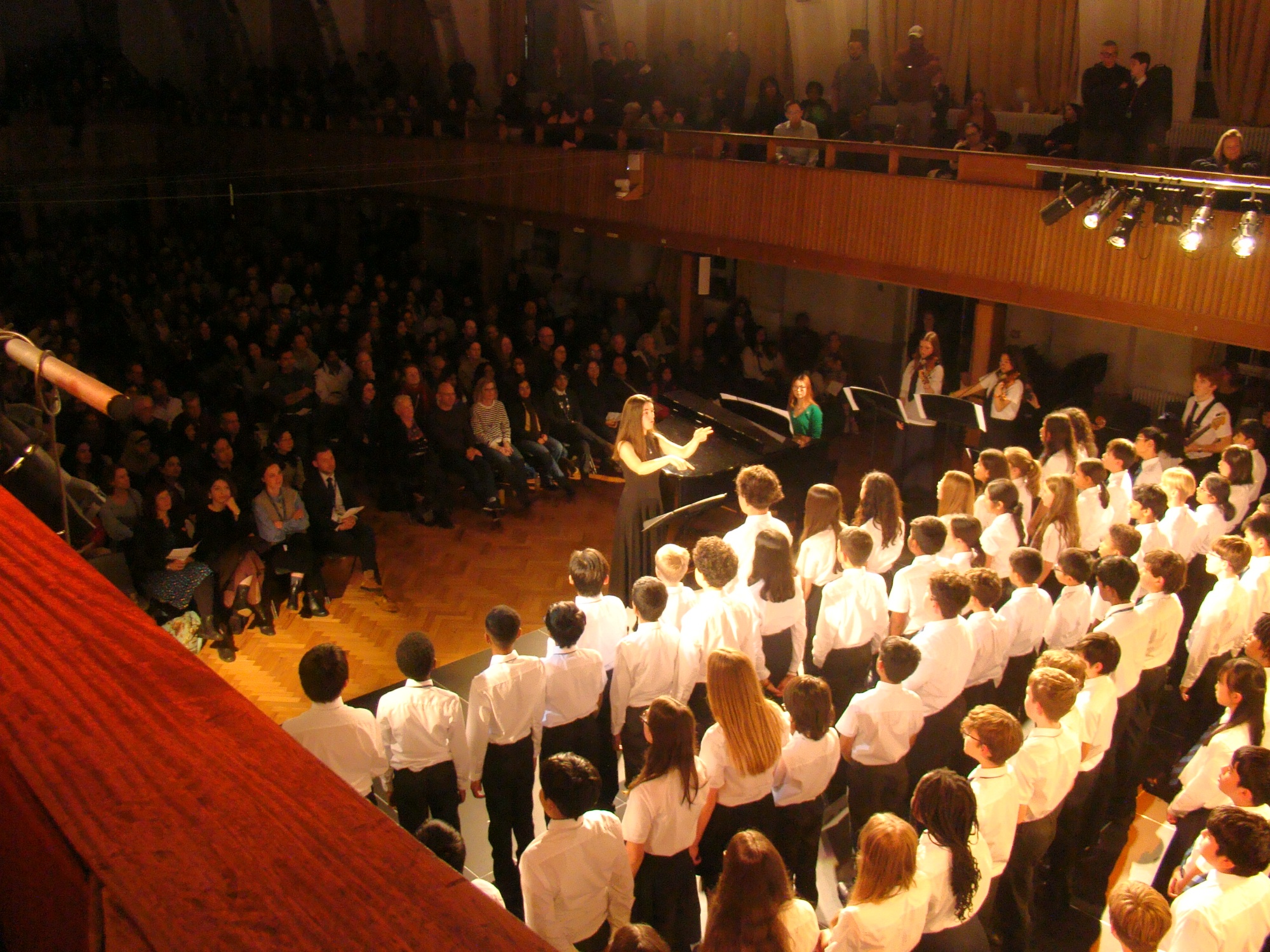 Year 7 students signing on stage in the Great Hall
