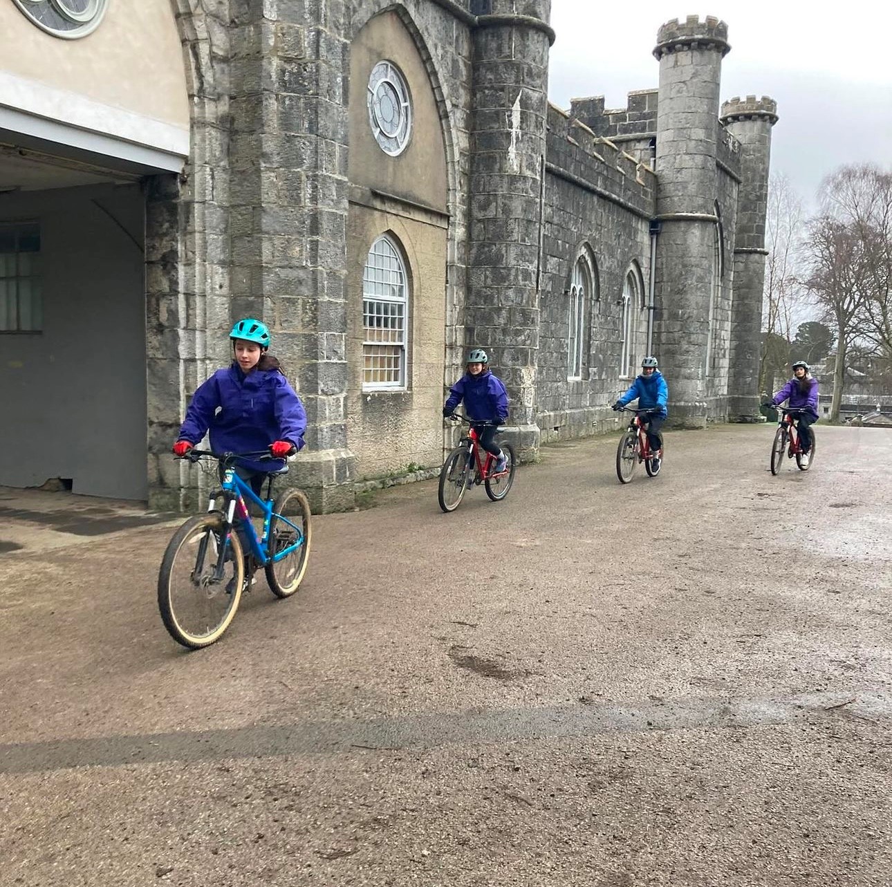 Four students cycling