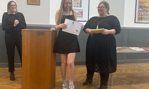 Awarding prizes during the poetry soirtee