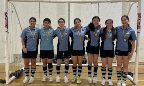 Girl Futsal team, 7 players posing