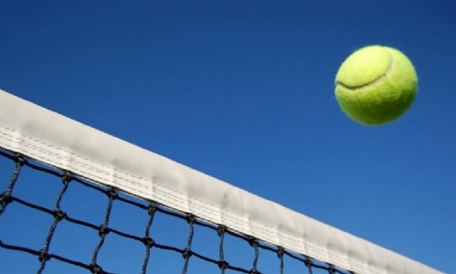 Tennis ball being thrown in the air