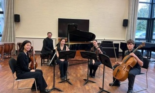 Our five music students sitting after playing