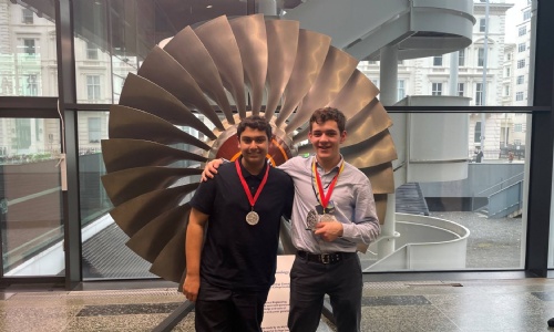Kian and Shaan posing with their medals