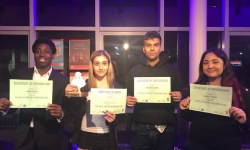 Four students showing their Certificate of participation