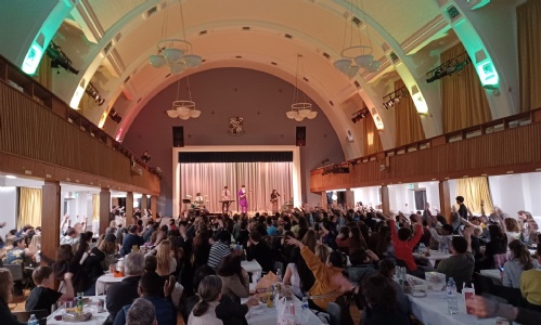 Band playing Purple Rain with the audience waving their arms