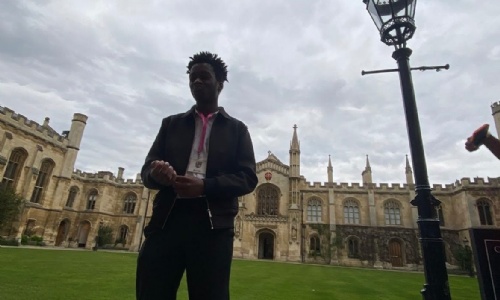 Perrez in front of the Corpus Christi college